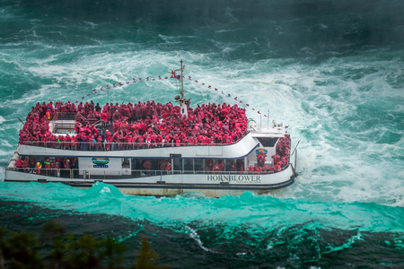 Niagara Falls - OCTOBER 06, 2018: The Maid of the Mist boat near waterfall at Niagara falls, Canada.のeditorial素材