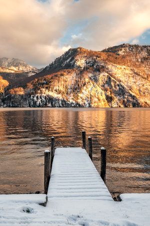 Scenic picture-postcard view of famous Hallstatt mountain village in the Austrian Alps at beautiful light in winter, Salzkammergut region, Hallstatt, Austria.の写真素材