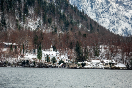 Scenic picture-postcard view of famous Hallstatt mountain village in the Austrian Alps at beautiful light in winter, Salzkammergut region, Hallstatt, Austria.の写真素材