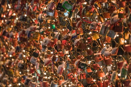 Locks on the bridge of lovers in the eveningの写真素材