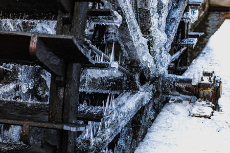 Old and ice-coverd watermill at winter in Prague, Czech Republic.の写真素材