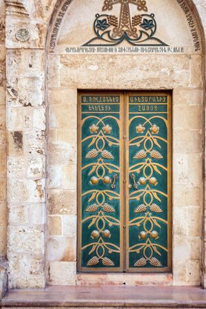 Jerusalem Israel - June 14, 2017: Ancient wooden door and stone walls in Jerusalem, Israel.