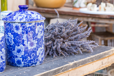 Large selection of bunches of lavender sold in a souvenir shop in Provence, France on a warm dayの写真素材