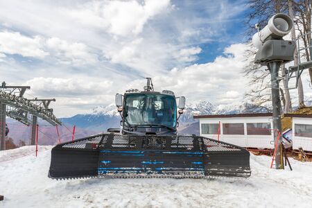 Snow plow on a snowy mountain in the spring on a clear day.の写真素材
