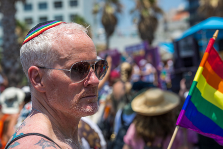 Tel Aviv, Israel - June 14 2019: 21th annual Tel Aviv Pride Week. At the parade, people walking, dancing, singing, waving banners and rainbow flags celebrating the largest LGBT event in the middle east.のeditorial素材