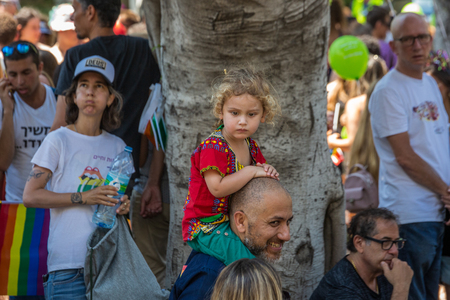 Tel Aviv, Israel - June 14 2019: 21th annual Tel Aviv Pride Week. At the parade, people walking, dancing, singing, waving banners and rainbow flags celebrating the largest LGBT event in the middle east.のeditorial素材