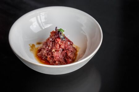 Beef tartare in the white plate.の写真素材