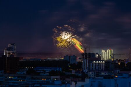 Fireworks light up the sky over night city. During this event person was killed by exploding...