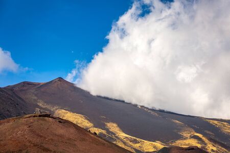Fog over peak of the mount Etna in Catania Sicily, Italy.の写真素材