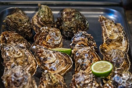Oysters at one of the fish stall that you can find at the fish market in Catania. Italy.の写真素材