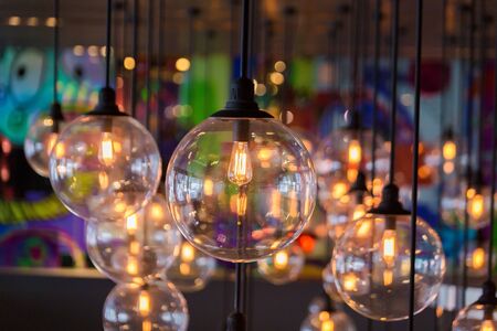 Round light bulbs, glowing with a soft light in the shopping center of Bangkok.