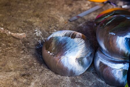 Making a bowl of iron, handmade in the village of Monks in Thailand.の写真素材
