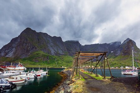 Cod dryer at Reine, fishing village is located on the island of Moskenesoya in the Lofoten archipelago, above the Arctic Circle, Norway.の写真素材