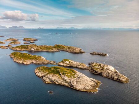 Incredible aerial view of Henningsvaer, its scenic football field and mountains in the background. A...