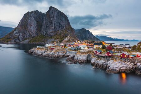 Famous tourist attraction Hamnoy fishing village on Lofoten Islands, Norway with red rorbu houses. Long exposure at sunset.の写真素材