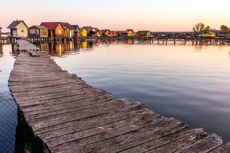 Floating village Bokodi in Hungary at sunrise. These houses belong to local fishermen.の写真素材