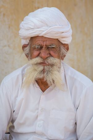 Jodhpur, India - March 08 2017: Portrait of an old man in national turban headdress. The man has a...