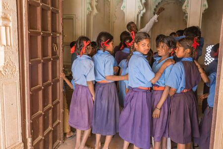 Udaipur, India - March 06 2017: A group of school children are watching their teacher. Some of them are distracted by the photographer.のeditorial素材