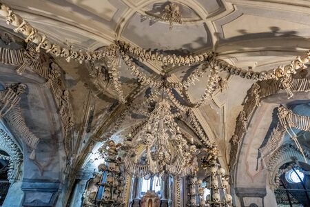 View of the Sedlec Ossuary interior detail. It contains the skeletons of between 40,000 and 70,000 people. Kutna Hora, Czech Republic - October 22 2019.のeditorial素材