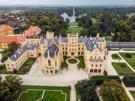 Aerial view. Lednice Chateau on sunny summer day, Moravia, Czech Republic. UNESCO World Heritage Site. Panoramic view. Lednice, Czech Republic - October 08 2019.のeditorial素材