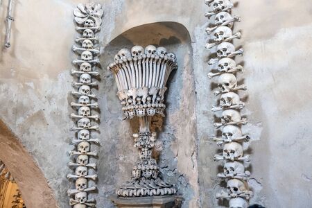 View of the Sedlec Ossuary interior detail. It contains the skeletons of between 40,000 and 70,000 people. Kutna Hora, Czech Republic - October 22 2019.のeditorial素材