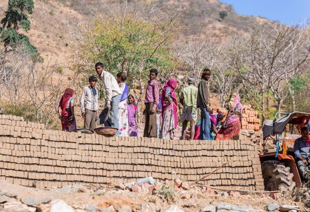 Udaipur, India - March 06 2017: Local man and woman working on brick making factory.のeditorial素材