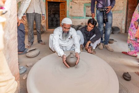 Jodhpur, India - March 08 2017: Handmade pots making from clay.のeditorial素材