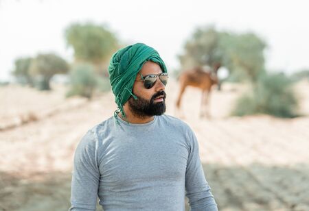 Jaisalmer, India - March 09 2017: Tourist in the desert with sunglasses.のeditorial素材