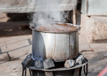 Udaipur, India - March 08 2017: Food stall making nasty looking food.のeditorial素材