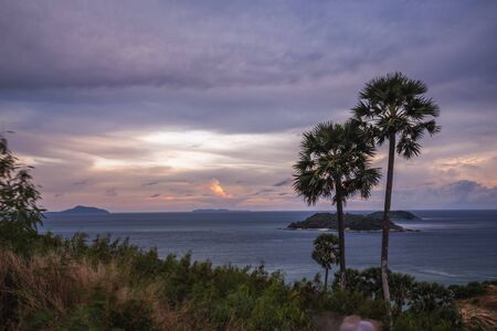 Beautiful tropical island with white sand beach and turquoise clear water, longtail boats and granite stones. Shoot of Freedom beach, Phuket, Thailand.の写真素材