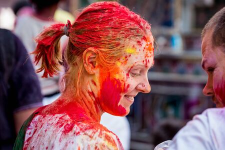 Vrindavan, India - March 12 2017: Indian people covered in different colours celebrating Holi festival in Vrindavan, India.のeditorial素材