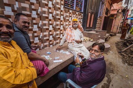 Agra, India - March 12 2017:  Indian man plaing cards at Holi festival in Vrindavan, India.