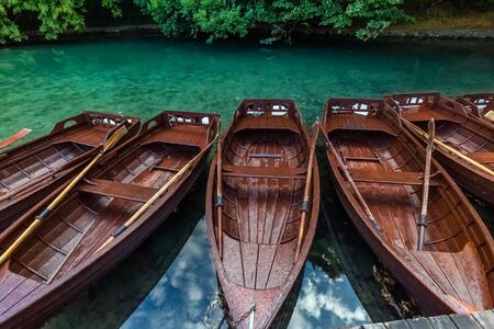 Wooden boats near waterfalls of one of the most astonishing places in the world at  Plitvice Lakes, Croatia. A truly virgin and wonderful piece of nature.の写真素材