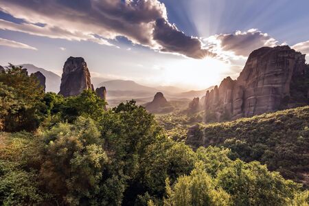 Monastery Meteora Greece. Stunning summer panoramic landscape. View at mountains and green forest against epic blue sky  clouds.   list object.の写真素材