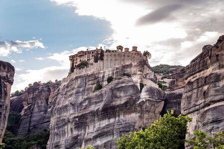 Monastery Meteora Greece. Stunning summer panoramic landscape. View at mountains and green forest against epic blue sky  clouds.   list object.の写真素材