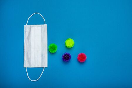 Surgical mask with rubber ear straps guardin from viruses. Coronavirus 2019-ncov epidemic concept. Procedure mask from bacteria. Protection concept.の写真素材