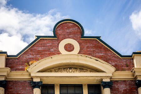 Side wall of vintage brick building with windows in Auckland, New Zealand.の写真素材