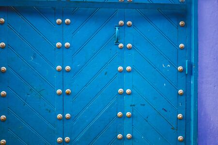 Colorful wooden doors at famous blue city of Chefchaouen, Morocco.の写真素材