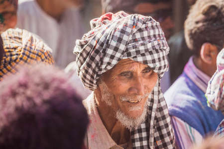 Vrindavan, India - March 12 2017: Indian people covered in different colours celebrating Holi festival in Vrindavan, India.のeditorial素材