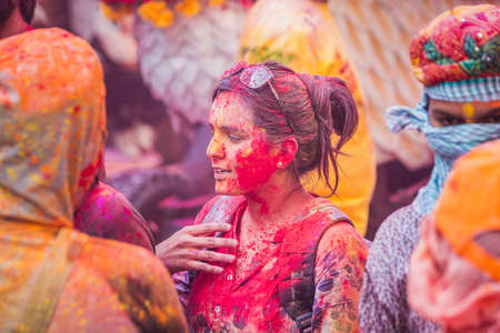 Vrindavan, India - March 12 2017: Indian people covered in different colours celebrating Holi festival in Vrindavan, India.のeditorial素材