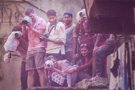 Vrindavan, India - March 12 2017: Photographers at Holi festival in Vrindavan, India.
