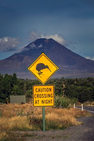 Kiwi sign with mountains at the background near Tongariro Alpine Crossing, New Zealand.の写真素材