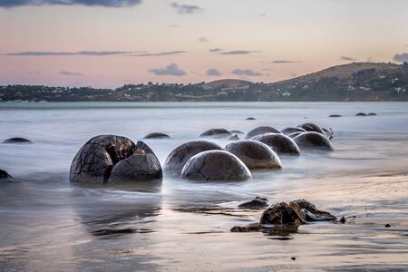 Round Moeraki Boulders at sunset, Koekohe beach, Otago, South Island, New Zealand.