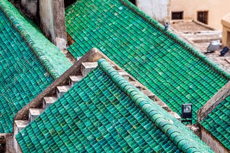 Cityscape View over the rooftops with green tiles of largest medina in Fes, Morocco, Africa. Maghreb, exterior.の写真素材