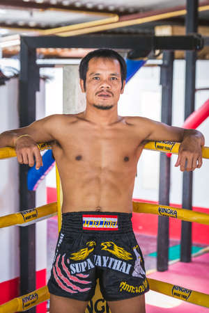 Attractive thai boxer posing at muay thai boxing camp at Phuket, Thailand. Phuket, Thailand - March 28 2017.のeditorial素材