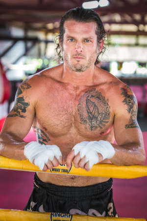 Attractive european boxer posing at muay thai boxing camp at Phuket, Thailand. Phuket, Thailand - March 28 2017.のeditorial素材