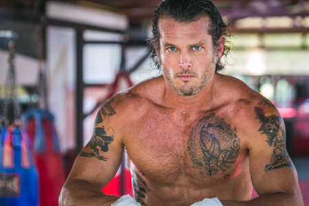 Attractive european boxer posing at muay thai boxing camp at Phuket, Thailand. Phuket, Thailand - March 28 2017.のeditorial素材