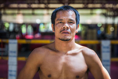 Attractive thai boxer posing at muay thai boxing camp at Phuket, Thailand. Phuket, Thailand - March 28 2017.のeditorial素材