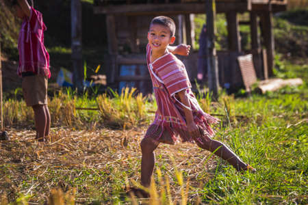 Children play soccer in the field at Doi Inthanon national park. Chiang Mai, Thailand - November 10 2017.のeditorial素材