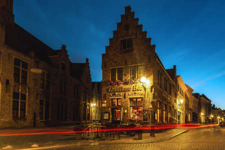 Blue hour shot of historic medieval buildings along a canal in Bruges, Belgium. Blue toning. Bruges, Belgium - July 28 2018.のeditorial素材